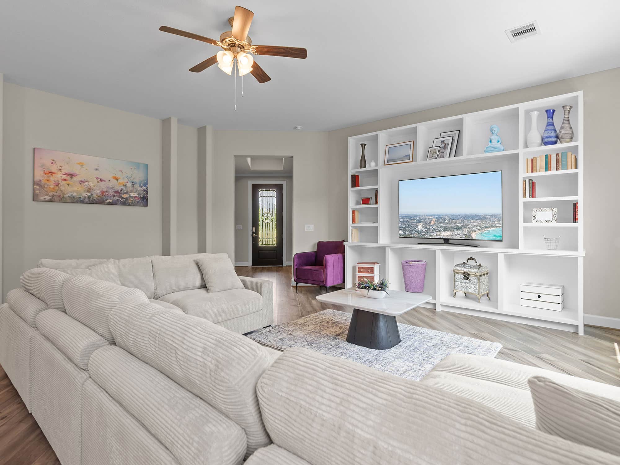 Promenade III living room with sectional sofa and built-in shelves at 1214 Hidden Oaks Dr