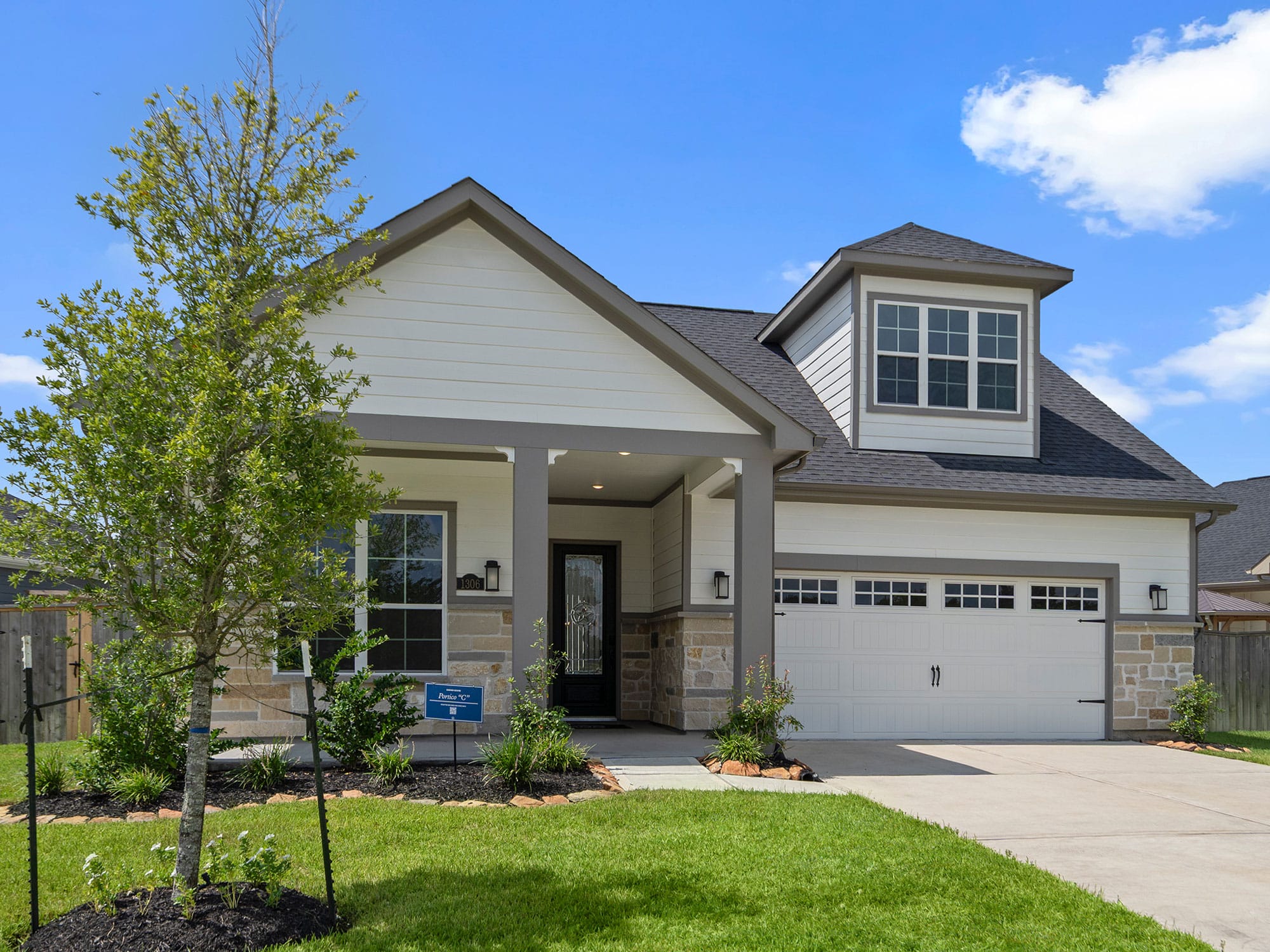 Front exterior of the Portico home at 1306 Hidden Oaks Dr in Winfrey Estates