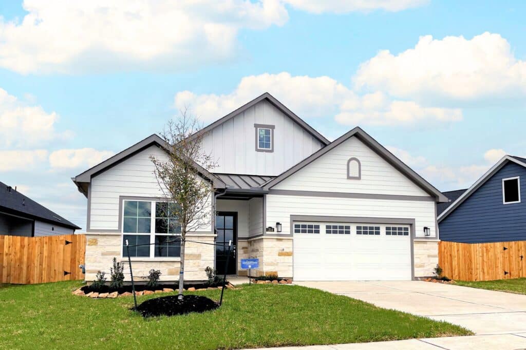 1314 Hidden Oaks Dr-Ext - New Homes in Houston & Tomball, TX | ROC Homes Exterior of 1314 Hidden Oaks Dr, a Portico plan home in Winfrey Estates, Tomball, TX